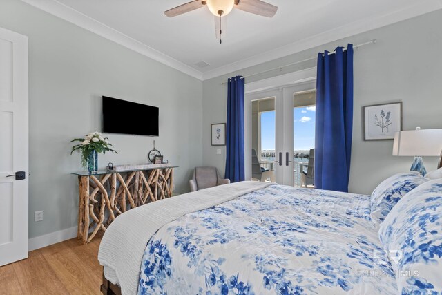 4029 Landfall Dr, Pensacola, FL 32507 - bedroom with french doors, a ceiling fan, wood finished floors, baseboards, and ornamental molding