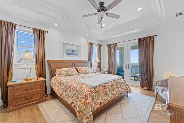 4029 Landfall Dr, Pensacola, FL 32507 - bedroom with a tray ceiling, access to exterior, light wood-type flooring, visible vents, and recessed lighting
