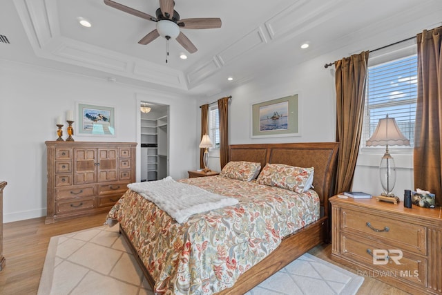 4029 Landfall Dr, Pensacola, FL 32507 - bedroom featuring recessed lighting, ornamental molding, light wood-style flooring, and a spacious closet