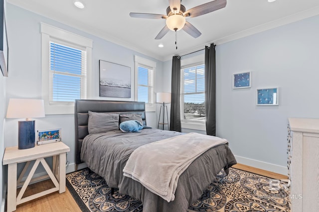 4029 Landfall Dr, Pensacola, FL 32507 - bedroom featuring baseboards, crown molding, multiple windows, and light wood-type flooring