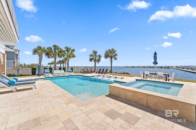 4029 Landfall Dr, Pensacola, FL 32507 - outdoor pool featuring fence, an in ground hot tub, a water view, and a patio area