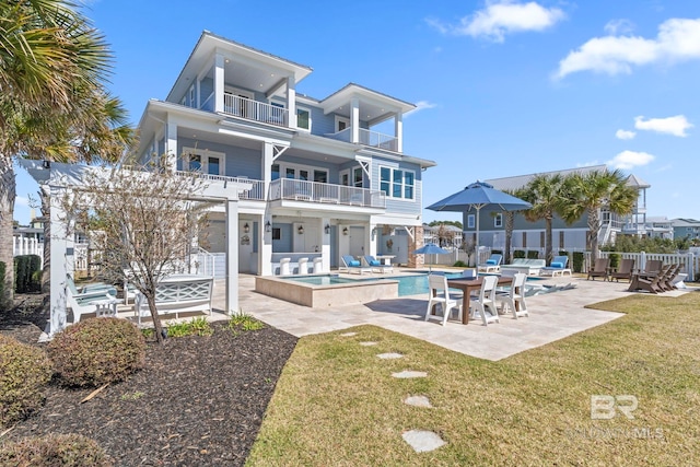 4029 Landfall Dr, Pensacola, FL 32507 - back of property with a hot tub, fence, a balcony, a yard, and a patio area