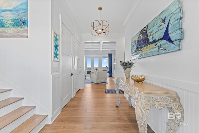 4029 Landfall Dr, Pensacola, FL 32507 - hall with crown molding, coffered ceiling, light wood-type flooring, beamed ceiling, and a notable chandelier
