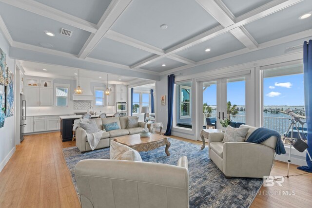 4029 Landfall Dr, Pensacola, FL 32507 - living area featuring beamed ceiling, coffered ceiling, and light wood-type flooring