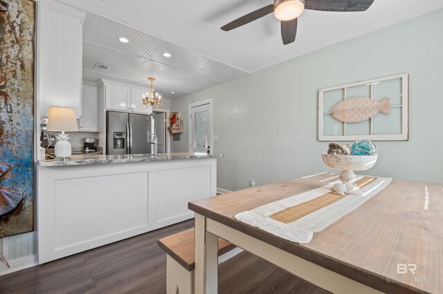 dining room with recessed lighting, visible vents, dark wood finished floors, and ceiling fan with notable chandelier