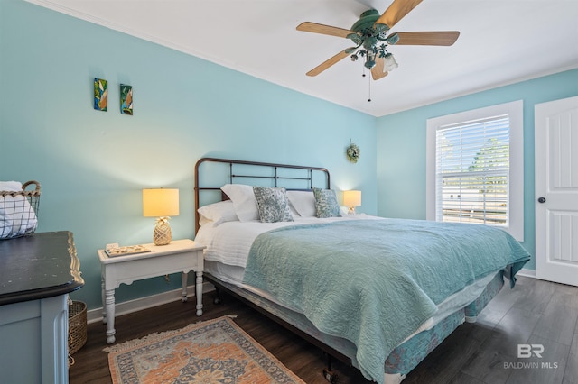 bedroom featuring a ceiling fan, baseboards, and dark wood-style flooring