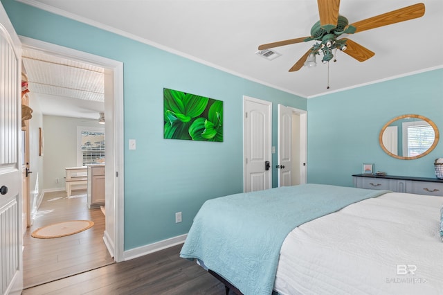 bedroom featuring ceiling fan, baseboards, wood finished floors, and ornamental molding