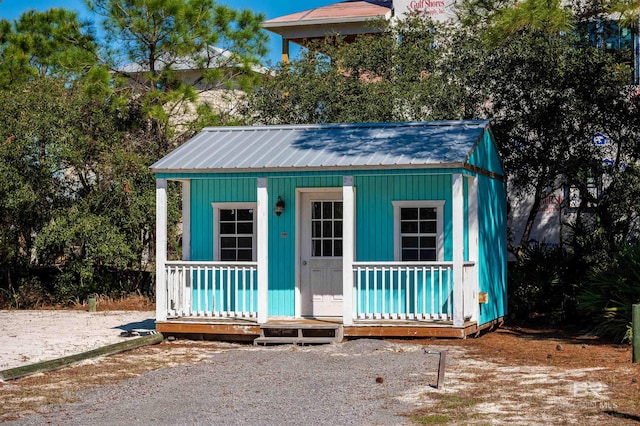 view of outbuilding featuring an outbuilding and a porch