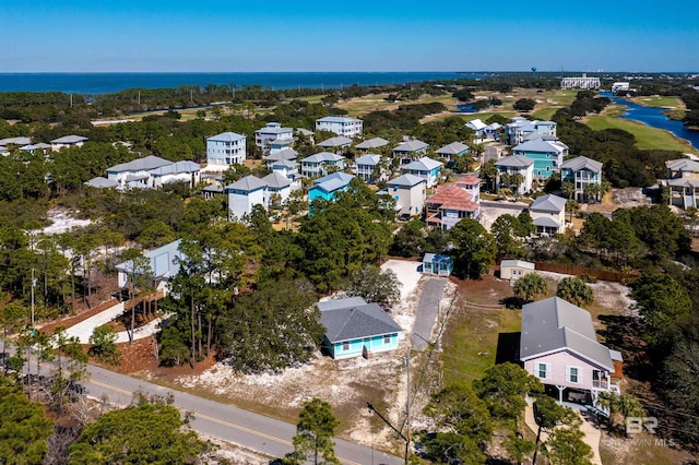 drone / aerial view featuring a residential view and a water view