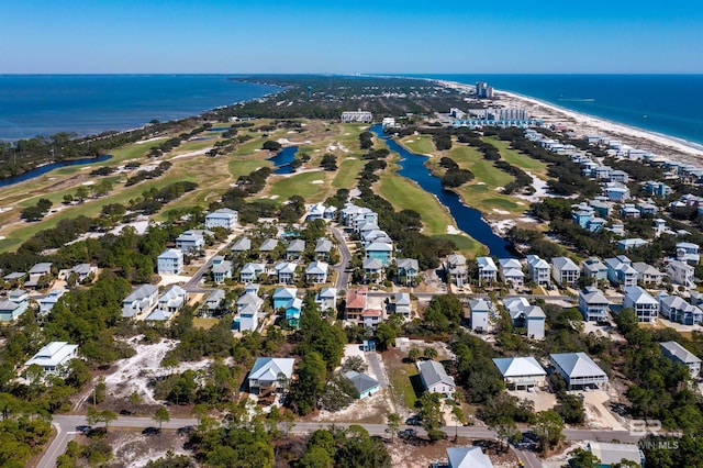 drone / aerial view featuring a residential view and a water view