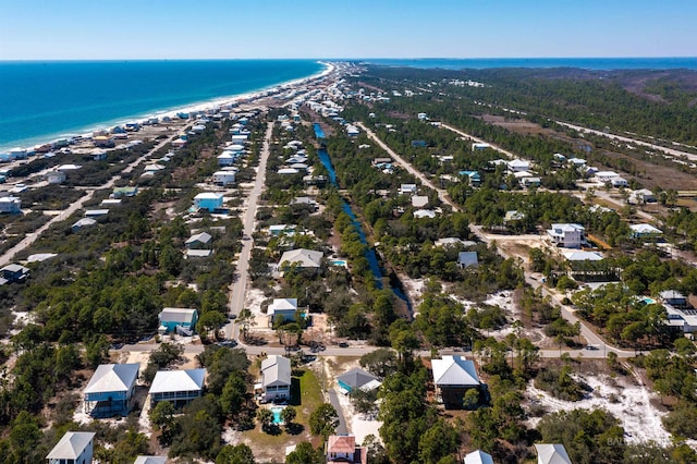 bird's eye view featuring a water view and a view of the beach