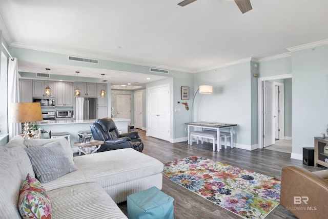 608 Lost Key Dr Unit 705C, Pensacola, FL 32507 - living area with crown molding, a ceiling fan, baseboards, and dark wood-style flooring