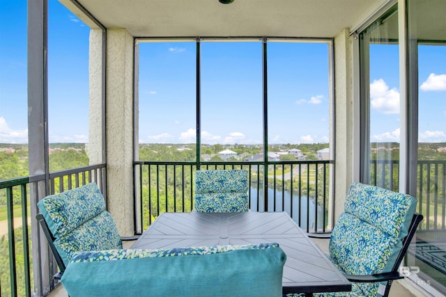 608 Lost Key Dr Unit 705C, Pensacola, FL 32507 - sunroom with healthy amount of natural light, a water view, and outdoor dining area