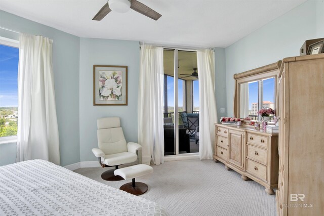 608 Lost Key Dr Unit 705C, Pensacola, FL 32507 - bedroom featuring access to exterior, light colored carpet, and ceiling fan