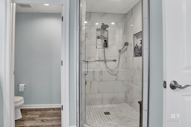 608 Lost Key Dr Unit 705C, Pensacola, FL 32507 - bathroom featuring a stall shower, toilet, wood finished floors, baseboards, and recessed lighting