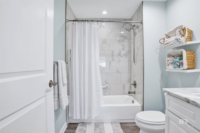 608 Lost Key Dr Unit 705C, Pensacola, FL 32507 - full bathroom featuring shower / tub combo with curtain, wood finished floors, vanity, and toilet