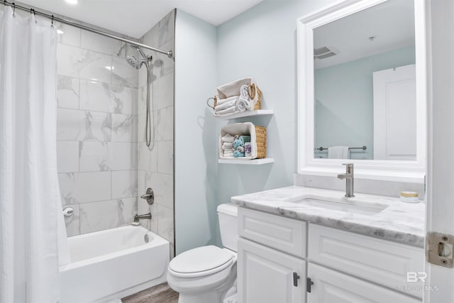 608 Lost Key Dr Unit 705C, Pensacola, FL 32507 - bathroom featuring toilet, shower / tub combo with curtain, vanity, and wood finished floors