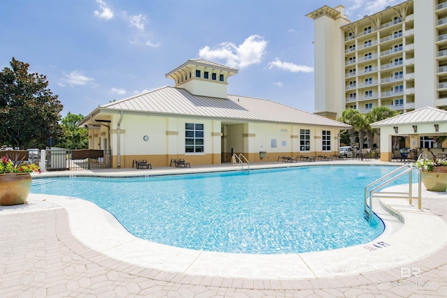 608 Lost Key Dr Unit 705C, Pensacola, FL 32507 - community pool featuring a patio and fence