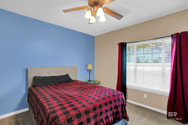 carpeted bedroom featuring ceiling fan