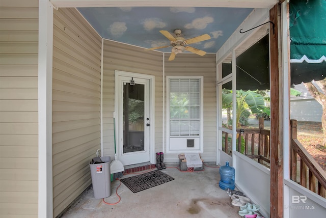 view of exterior entry featuring ceiling fan