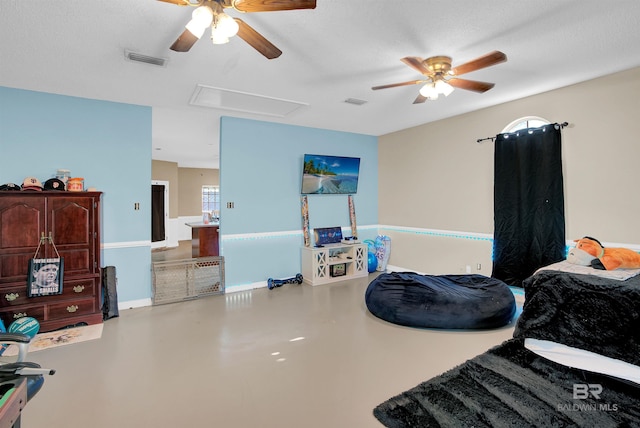 bedroom featuring ceiling fan, a textured ceiling, and concrete flooring