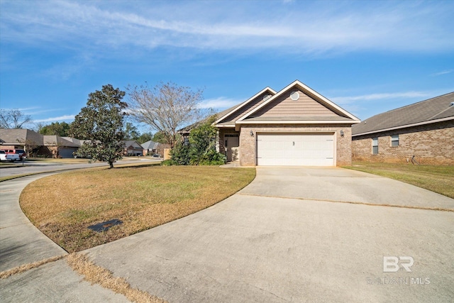 view of front facade with a front yard and a garage