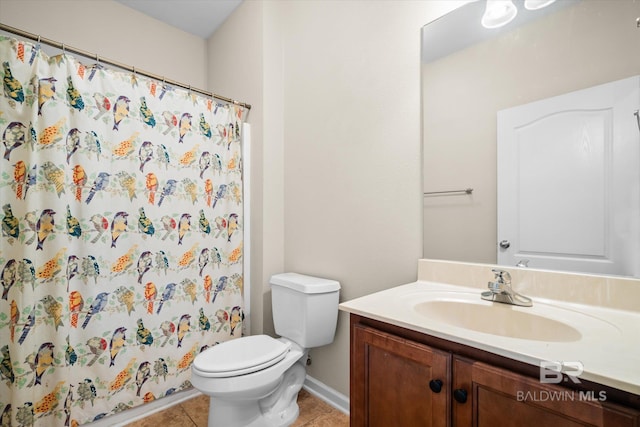 bathroom featuring toilet, a shower with curtain, vanity, and tile patterned floors