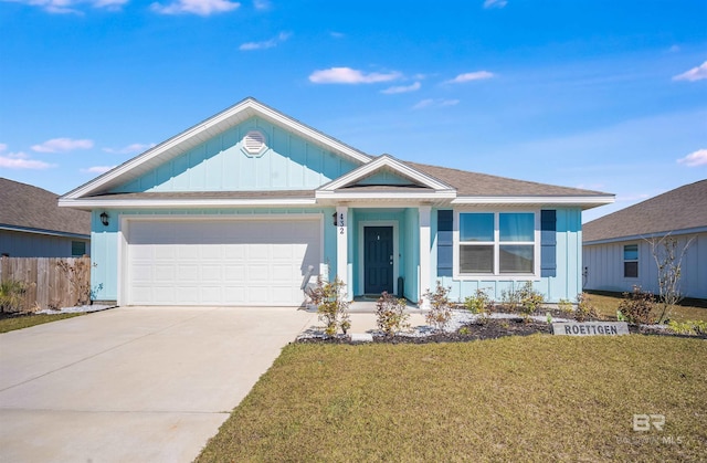 ranch-style house with an attached garage, fence, concrete driveway, board and batten siding, and a front yard