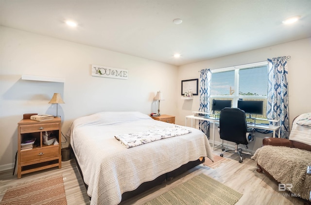 bedroom featuring baseboards, recessed lighting, and light wood-style floors