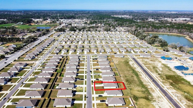 aerial view with a water view and a residential view