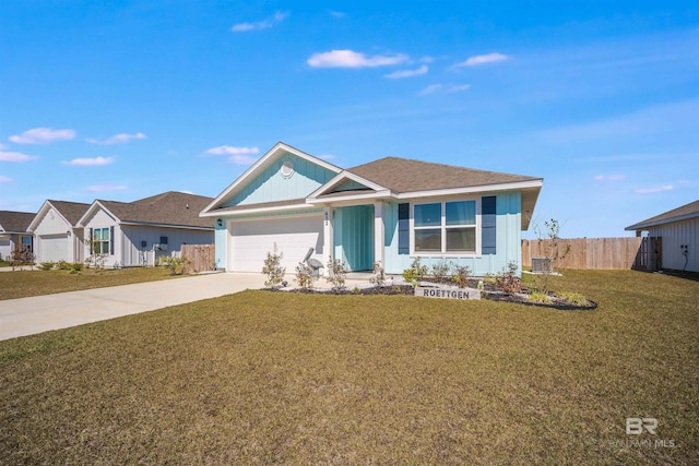 ranch-style house with a garage, concrete driveway, fence, board and batten siding, and a front yard