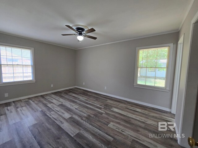 114 Spruce Ave, Brewton, AL 36426 - empty room with plenty of natural light, a ceiling fan, dark wood-type flooring, crown molding, and baseboards