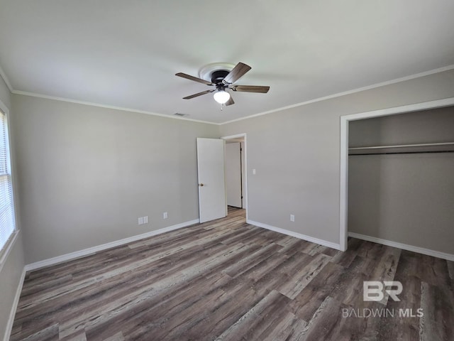 114 Spruce Ave, Brewton, AL 36426 - unfurnished bedroom featuring wood finished floors, a closet, baseboards, ornamental molding, and ceiling fan