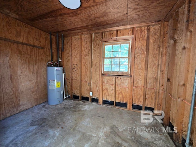 114 Spruce Ave, Brewton, AL 36426 - miscellaneous room featuring electric water heater and concrete flooring