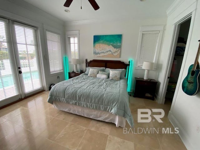 tiled bedroom with ceiling fan, ornamental molding, french doors, and access to exterior