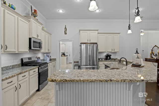 kitchen with a large island, crown molding, and appliances with stainless steel finishes