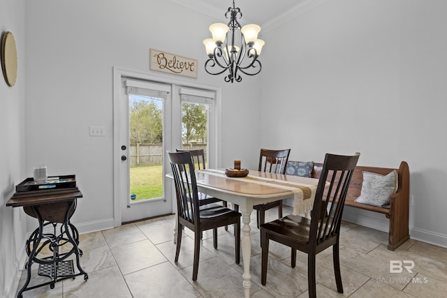 dining area featuring crown molding, light tile patterned floors, and an inviting chandelier