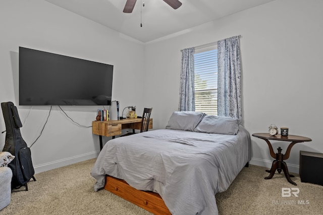 bedroom featuring ceiling fan and light carpet