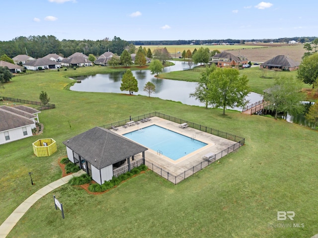 view of swimming pool with a water view