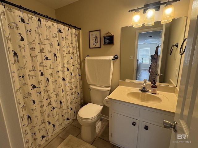 full bath featuring tile patterned flooring, curtained shower, toilet, and vanity