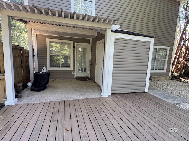 deck featuring a patio and fence