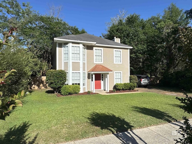 2309 Crystal Ky, Mobile, AL 36695 - colonial-style house featuring a front lawn and a chimney