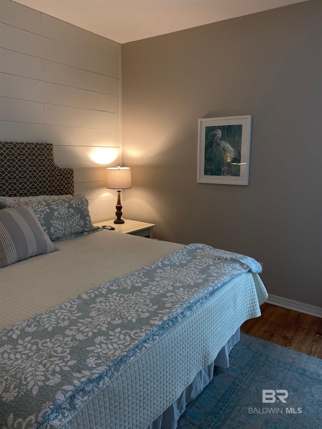 5781 State Highway 180 Unit 6006, Gulf Shores, AL 36542 - bedroom featuring wood finished floors and baseboards