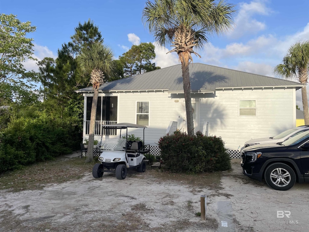view of home's exterior featuring metal roof