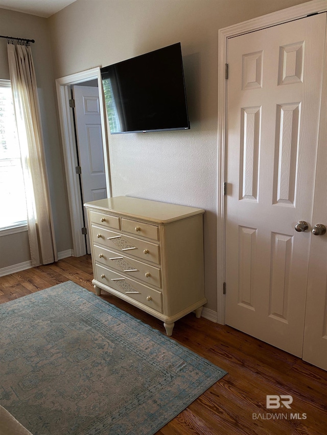5781 State Highway 180 Unit 6006, Gulf Shores, AL 36542 - bedroom featuring wood finished floors and baseboards