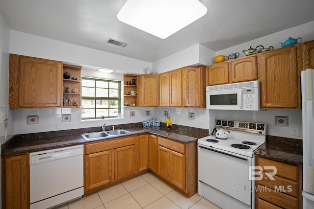 35788 Boykin Blvd, Lillian, AL 36549 - kitchen with visible vents, open shelves, decorative backsplash, white appliances, and a sink