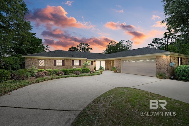 35788 Boykin Blvd, Lillian, AL 36549 - view of front of house with brick siding, a garage, and concrete driveway