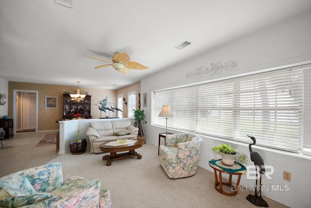 35788 Boykin Blvd, Lillian, AL 36549 - living area featuring baseboards, visible vents, and ceiling fan with notable chandelier