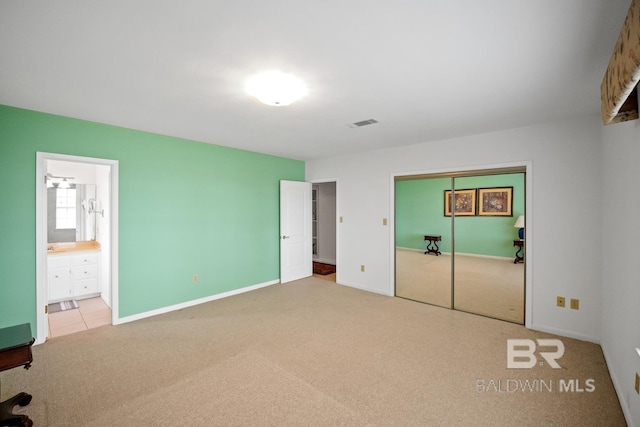 35788 Boykin Blvd, Lillian, AL 36549 - unfurnished bedroom featuring carpet floors, baseboards, visible vents, and a closet