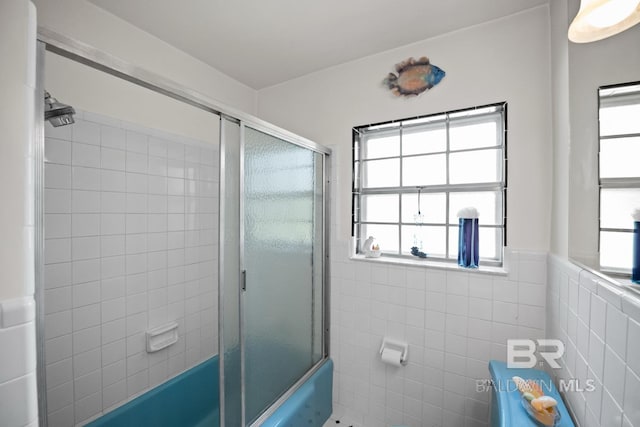 35788 Boykin Blvd, Lillian, AL 36549 - bathroom with enclosed tub / shower combo, tile walls, and a wainscoted wall